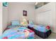 Bright bedroom with twin beds featuring colorful comforters and decorations at 4640 Eagle Peak Dr, Kissimmee, FL 34746
