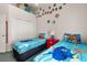 Bedroom with twin beds featuring colorful comforters and decorations at 4640 Eagle Peak Dr, Kissimmee, FL 34746