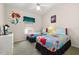 Bright bedroom with twin beds featuring colorful comforters at 4640 Eagle Peak Dr, Kissimmee, FL 34746