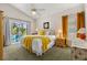 This main bedroom boasts a screened patio, king bed, and ensuite bath for relaxing privacy at 4640 Eagle Peak Dr, Kissimmee, FL 34746
