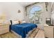 Cozy bedroom features a large window for natural light, creating a serene and comfortable space at 4640 Eagle Peak Dr, Kissimmee, FL 34746