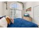 Comfortable bedroom features a large window with natural light, creating a serene and comfortable space at 4640 Eagle Peak Dr, Kissimmee, FL 34746