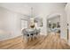 Bright dining room features wood floors, chandelier, and an open floor plan at 4640 Eagle Peak Dr, Kissimmee, FL 34746