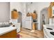 Kitchen offering plenty of cabinet space, white appliances, and laminate wood flooring at 4640 Eagle Peak Dr, Kissimmee, FL 34746