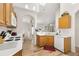 Kitchen featuring wooden cabinets, laminate flooring, and white appliances at 4640 Eagle Peak Dr, Kissimmee, FL 34746