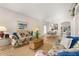 Relax in the living room with hardwood floors, vaulted ceiling, and bright natural light at 4640 Eagle Peak Dr, Kissimmee, FL 34746