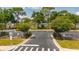 View of parking lot with trees and shrubbery at 4640 Eagle Peak Dr, Kissimmee, FL 34746