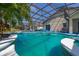 Refreshing screened-in pool surrounded by comfortable seating, ideal for relaxation and socializing at 4640 Eagle Peak Dr, Kissimmee, FL 34746