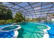 Beautiful screened-in pool and spa with sun-drenched deck for resort-style living at 4640 Eagle Peak Dr, Kissimmee, FL 34746