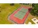 Aerial view of a community tennis court with newly painted surfacing and surrounding fences at 4640 Eagle Peak Dr, Kissimmee, FL 34746