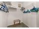 Walk-in closet showcasing functional shelving, luggage rack and storage space at 4640 Eagle Peak Dr, Kissimmee, FL 34746