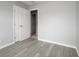Bedroom with laminate flooring, closet, and neutral wall color at 4824 Shoshone St, Orlando, FL 32819