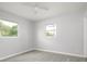 Bright bedroom with two windows and sleek laminate flooring at 4824 Shoshone St, Orlando, FL 32819