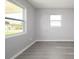 Bright bedroom with natural light and laminate wood flooring at 4824 Shoshone St, Orlando, FL 32819