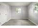 Inviting bedroom with hardwood floors, plenty of natural light, and white trim at 4824 Shoshone St, Orlando, FL 32819