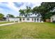 Charming single-story home with a well-manicured lawn and covered carport at 4824 Shoshone St, Orlando, FL 32819