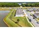 This aerial view highlights a townhome's proximity to a pond, well-kept lawns, and community parking at 4829 Cedar Bay Ter, Kissimmee, FL 34746