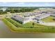 A townhome community features a pond, well-kept lawns, parking, and easy access to the highway at 4829 Cedar Bay Ter, Kissimmee, FL 34746