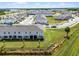 Aerial view of townhomes, showcasing well-maintained lawns, sidewalks, community parking, and landscaping at 4829 Cedar Bay Ter, Kissimmee, FL 34746