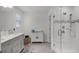 Bright bathroom featuring a glass shower, white vanity, and tiled floors at 4829 Cedar Bay Ter, Kissimmee, FL 34746
