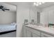 Bathroom view towards Primary bedroom with fan at 4829 Cedar Bay Ter, Kissimmee, FL 34746