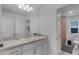 Bathroom with a well-lit vanity, and a toilet area with shower at 4829 Cedar Bay Ter, Kissimmee, FL 34746
