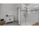 This modern bathroom is equipped with a glass enclosed shower and linen storage at 4829 Cedar Bay Ter, Kissimmee, FL 34746