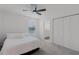 Bedroom featuring a ceiling fan, large closet, and ensuite bathroom at 4829 Cedar Bay Ter, Kissimmee, FL 34746