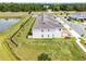A well-maintained townhome boasts a lush green lawn, fenced backyard, and proximity to a tranquil pond at 4829 Cedar Bay Ter, Kissimmee, FL 34746