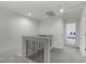 Bright hallway showcasing upper level of a house with white walls and carpeted floors leading to other rooms at 4829 Cedar Bay Ter, Kissimmee, FL 34746