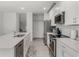 Well-equipped kitchen featuring stainless steel appliances, a center island, and plenty of storage for a functional layout at 4829 Cedar Bay Ter, Kissimmee, FL 34746
