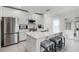 Stylish kitchen boasts a large center island with seating, stainless steel appliances, and a bright, airy atmosphere at 4829 Cedar Bay Ter, Kissimmee, FL 34746