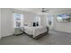 Bright main bedroom featuring large windows, plush carpet, and decorative lighting fixtures at 4829 Cedar Bay Ter, Kissimmee, FL 34746