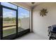 Enclosed patio with a ceiling fan, a view to the backyard, and decorative sun art adding charm at 4829 Cedar Bay Ter, Kissimmee, FL 34746