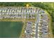 An aerial shot reveals a lakeside neighborhood with green trees and well-maintained lawns at 5079 Royal Point Ave, Kissimmee, FL 34746