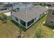 An aerial shot features a clean backyard with a screened in lanai at 5079 Royal Point Ave, Kissimmee, FL 34746