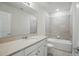 Bathroom featuring a vanity, toilet and shower-tub combo at 5079 Royal Point Ave, Kissimmee, FL 34746