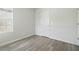 Bedroom featuring light wood floors, a window and white trim at 5079 Royal Point Ave, Kissimmee, FL 34746