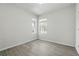 Bright bedroom with dual windows and light wood floors at 5079 Royal Point Ave, Kissimmee, FL 34746