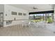A shaded seating area, equipped with tables, perfect for community socializing near the pool at 5079 Royal Point Ave, Kissimmee, FL 34746