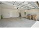 Spacious two-car garage with painted walls, and a clean floor at 5079 Royal Point Ave, Kissimmee, FL 34746