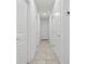 Neutral hallway featuring recessed lights and access to multiple rooms at 5079 Royal Point Ave, Kissimmee, FL 34746