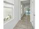 Bright hallway features tile flooring and access to the patio through sliding glass doors at 5079 Royal Point Ave, Kissimmee, FL 34746