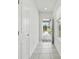 Hallway showing natural light streaming through the front door at 5079 Royal Point Ave, Kissimmee, FL 34746