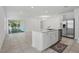 Open kitchen with stainless appliances and large island at 5079 Royal Point Ave, Kissimmee, FL 34746