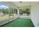 Enjoy bug-free outdoor relaxation in the screened lanai with a view of the verdant backyard at 5079 Royal Point Ave, Kissimmee, FL 34746