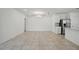 Living room adjacent to the kitchen and featuring tile flooring at 5079 Royal Point Ave, Kissimmee, FL 34746