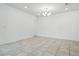 Living room with tile floors and chandelier at 5079 Royal Point Ave, Kissimmee, FL 34746