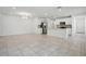 Open living space with kitchen, tile floors, and stainless steel appliances at 5079 Royal Point Ave, Kissimmee, FL 34746