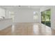 Open-concept living area with tile flooring and sliding glass doors at 5079 Royal Point Ave, Kissimmee, FL 34746
